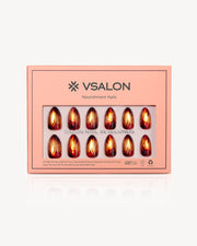 VSALON Amber Whisper press-on nails featuring a golden brown cat-eye design with molten amber flame-inspired swirls and a warm shimmer finish.
