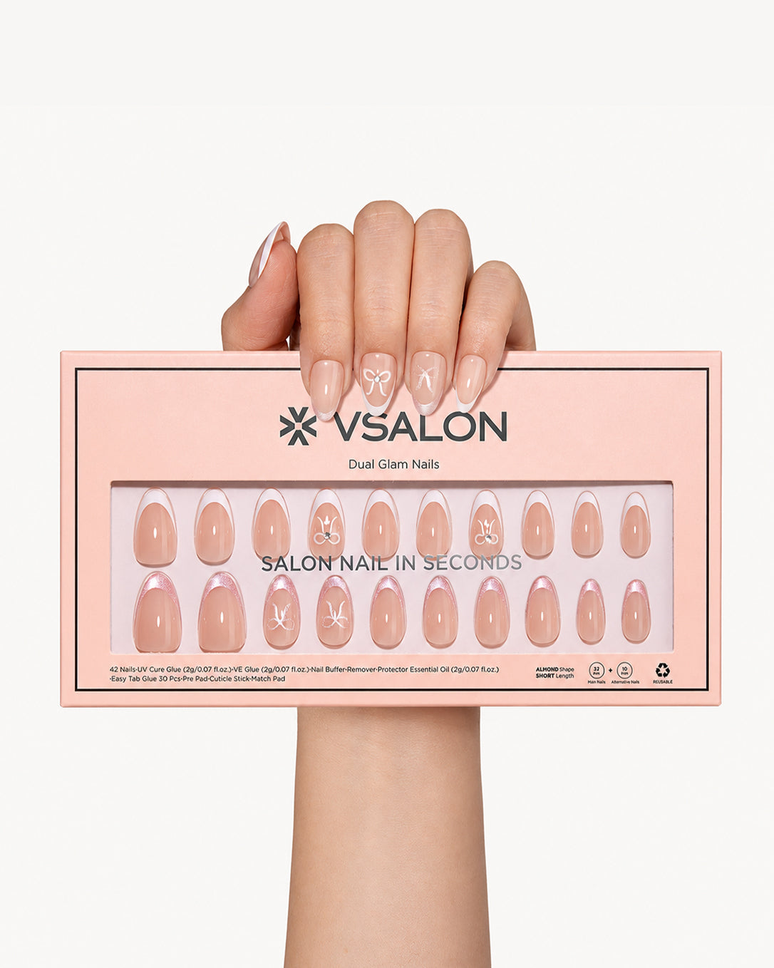 Lover's Note romantic French tip press-on nail set displayed with VSALON packaging showing bow detail and pink glitter manicure designs