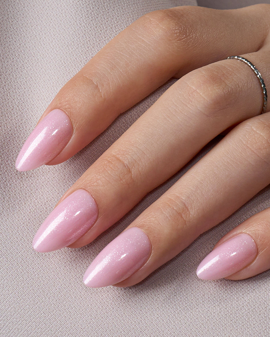 Rose Delight soft pink almond press-on nails creating a feminine, clean and elegant everyday manicure look
