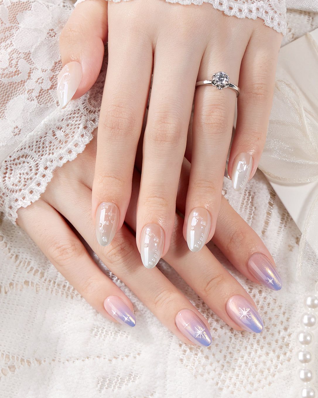 Weekend Warrior romantic gradient press-on nails styled with lace details featuring pearl accents and star nail art for wedding and elegant occasion looks