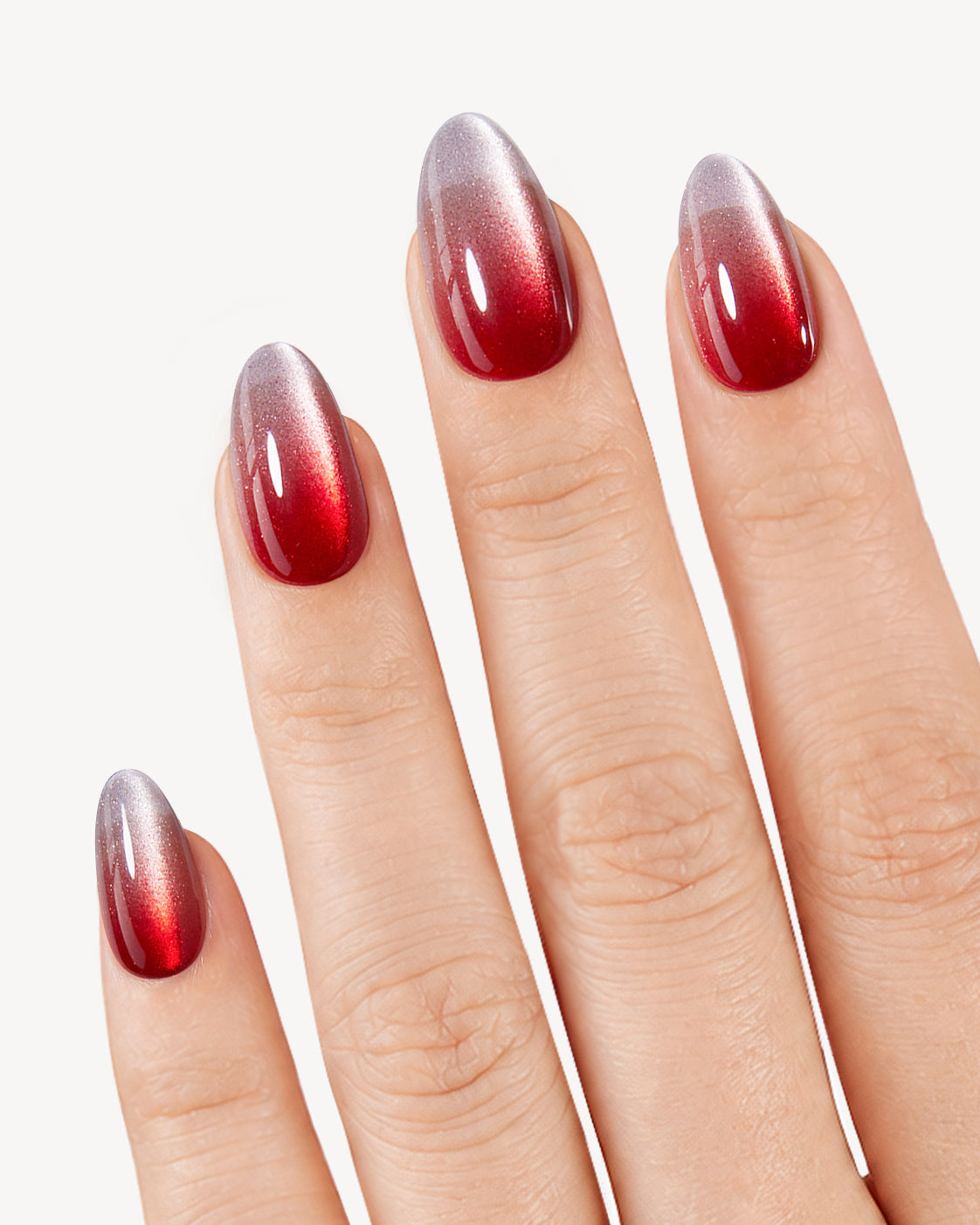 Scarlet Spell red ombre cat eye press-on nails with luminous magnetic glow on natural nails