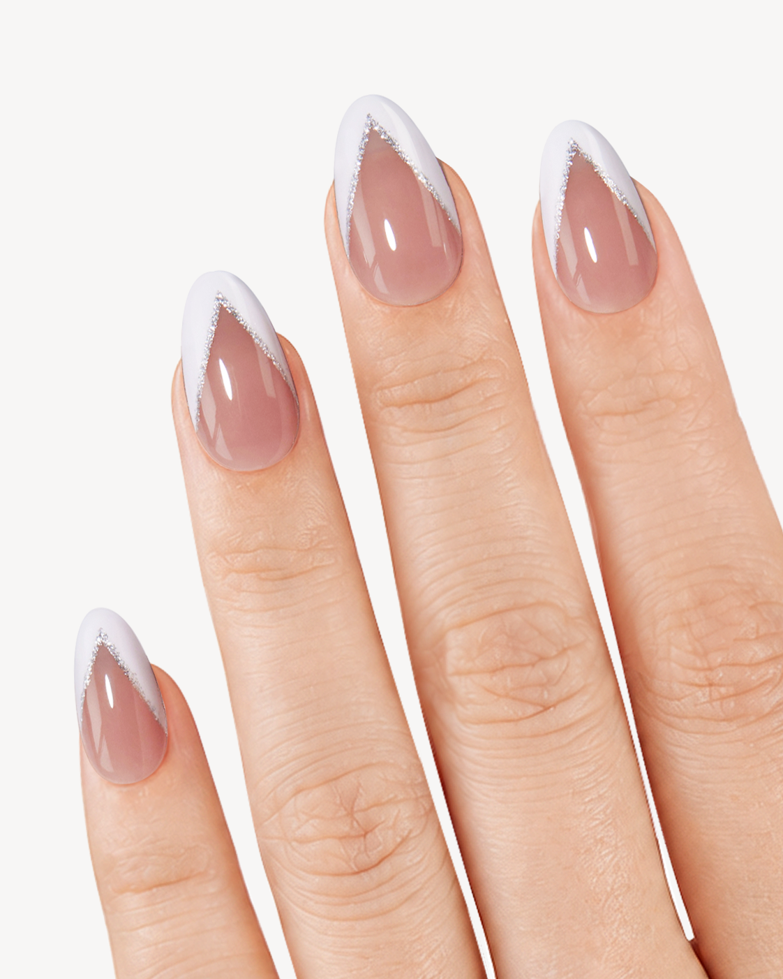 VSALON Honey medium almond soft gel press-on nails worn on hand with sheer pink bases and silver-lined white V-tips