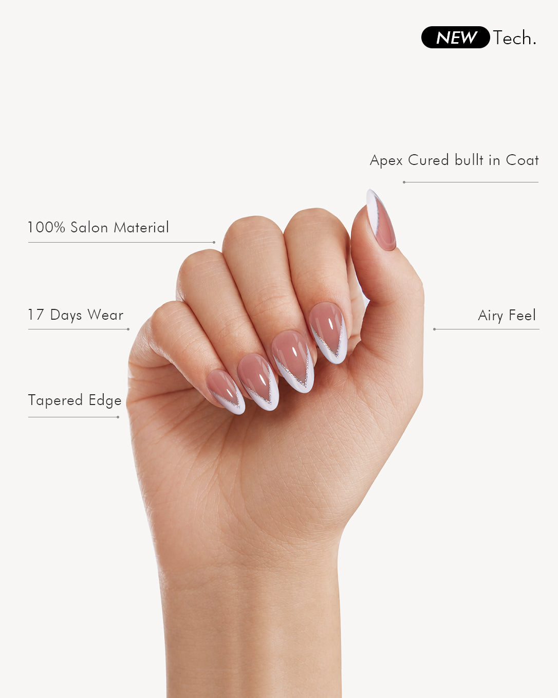 Full-hand view of Honey medium almond soft gel press-on nails with sheer pink bases and silver-lined white V-tips