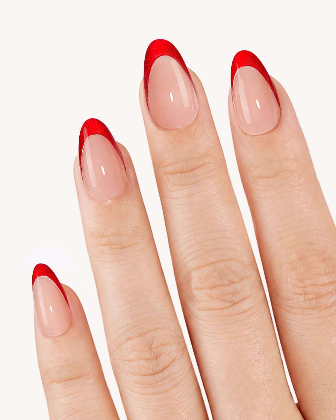 VSALON Cherry Heat short almond soft gel press-on nails worn on hand with nude bases and glossy cherry red French tips
