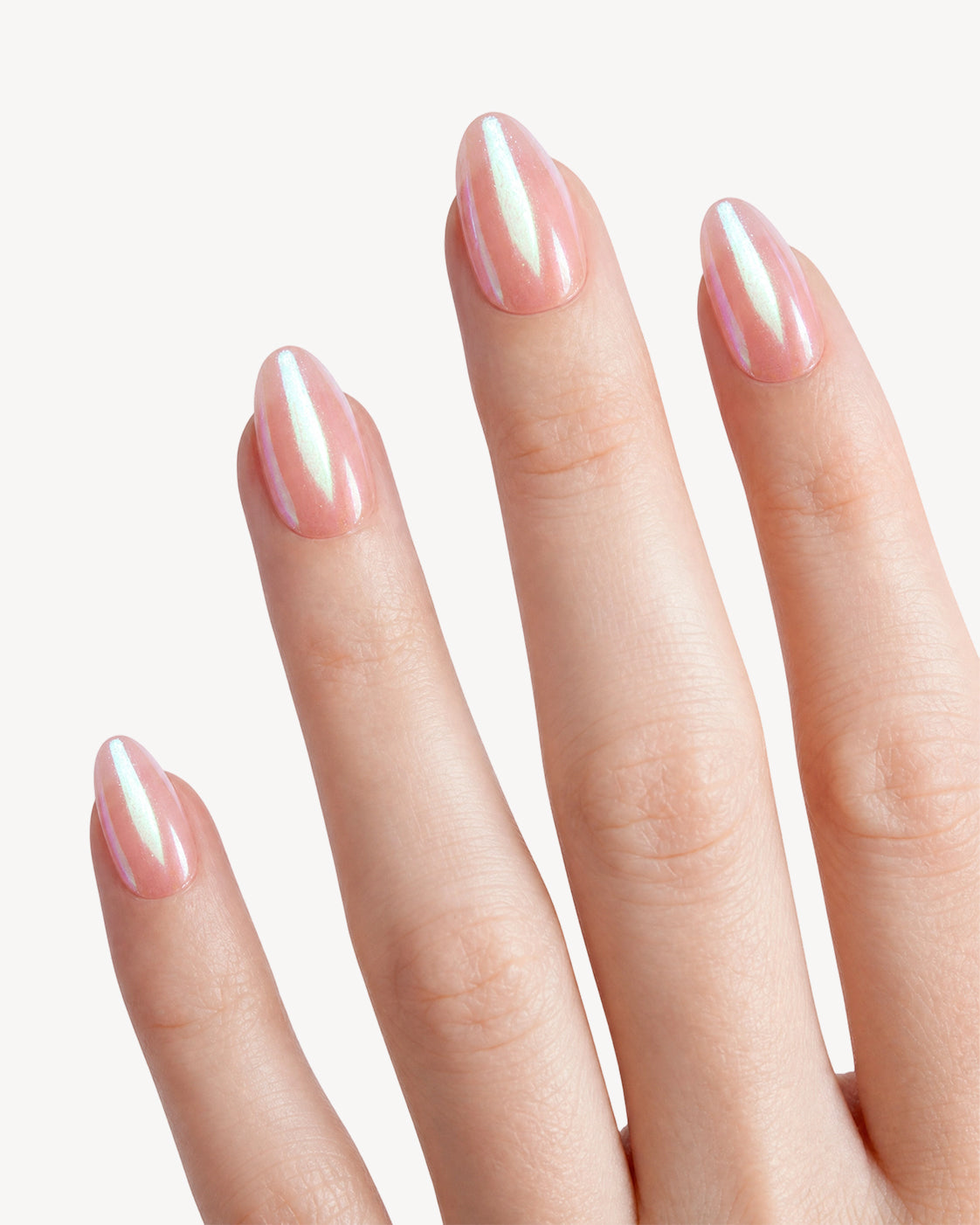 VSALON Burst short almond soft gel press-on nails worn on hand with a peach-pink base and iridescent holographic sheen