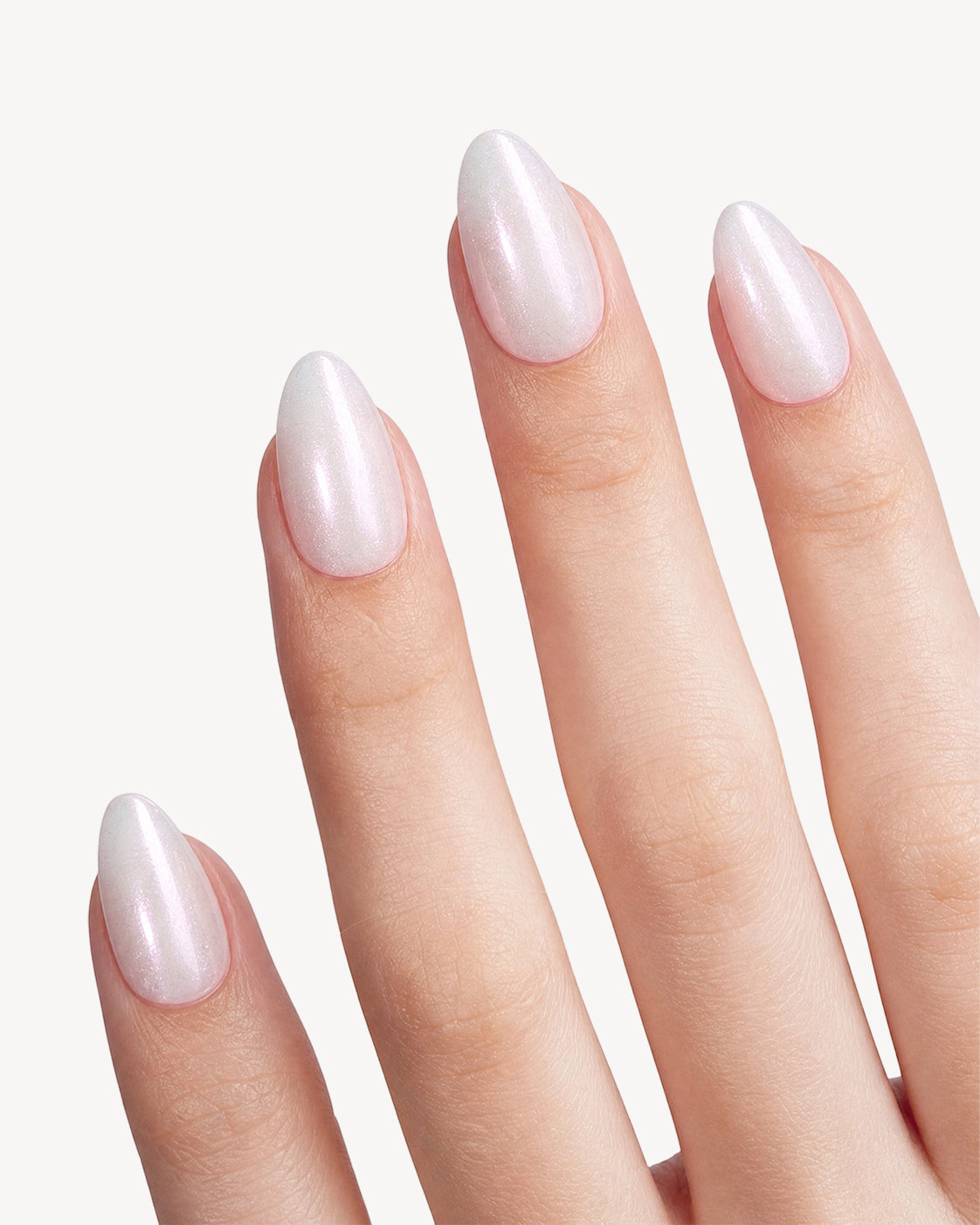 VSALON Aurora's Angel short almond soft gel press-on nails worn on hand with a soft white base and pearly lavender sheen