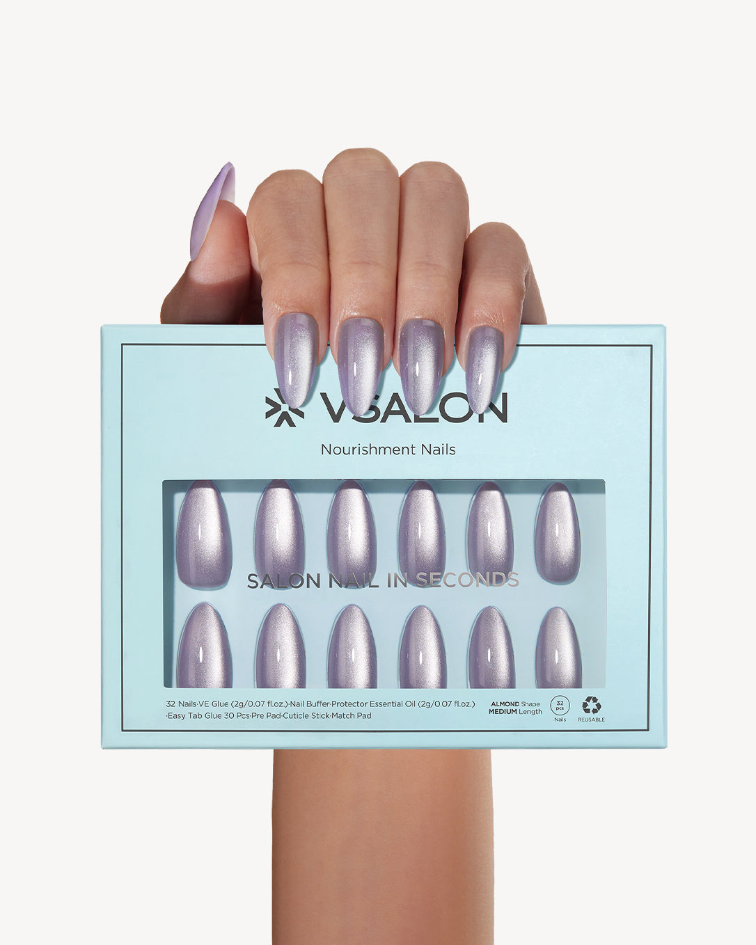 Hand holding VSALON Lilac Aura press-on nails with a chic lavender manicure and delicate silver sparkle details.