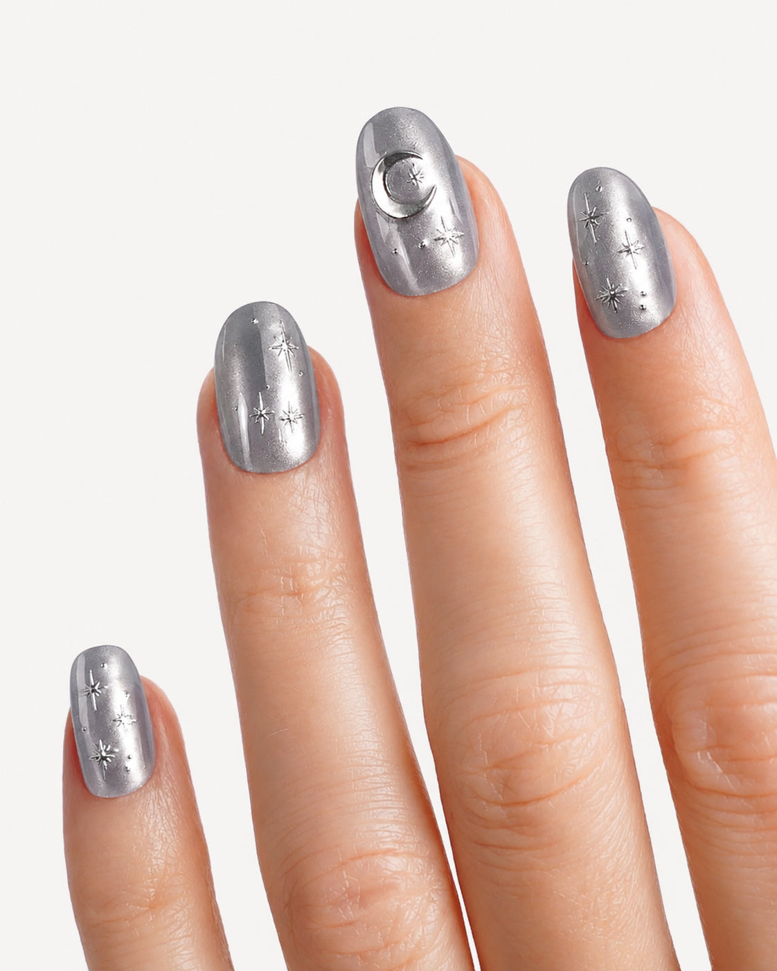 Close-up of VSALON Moonlight Sonata press-on nails showcasing the frosty cat-eye shimmer and silver star and moon nail art details.