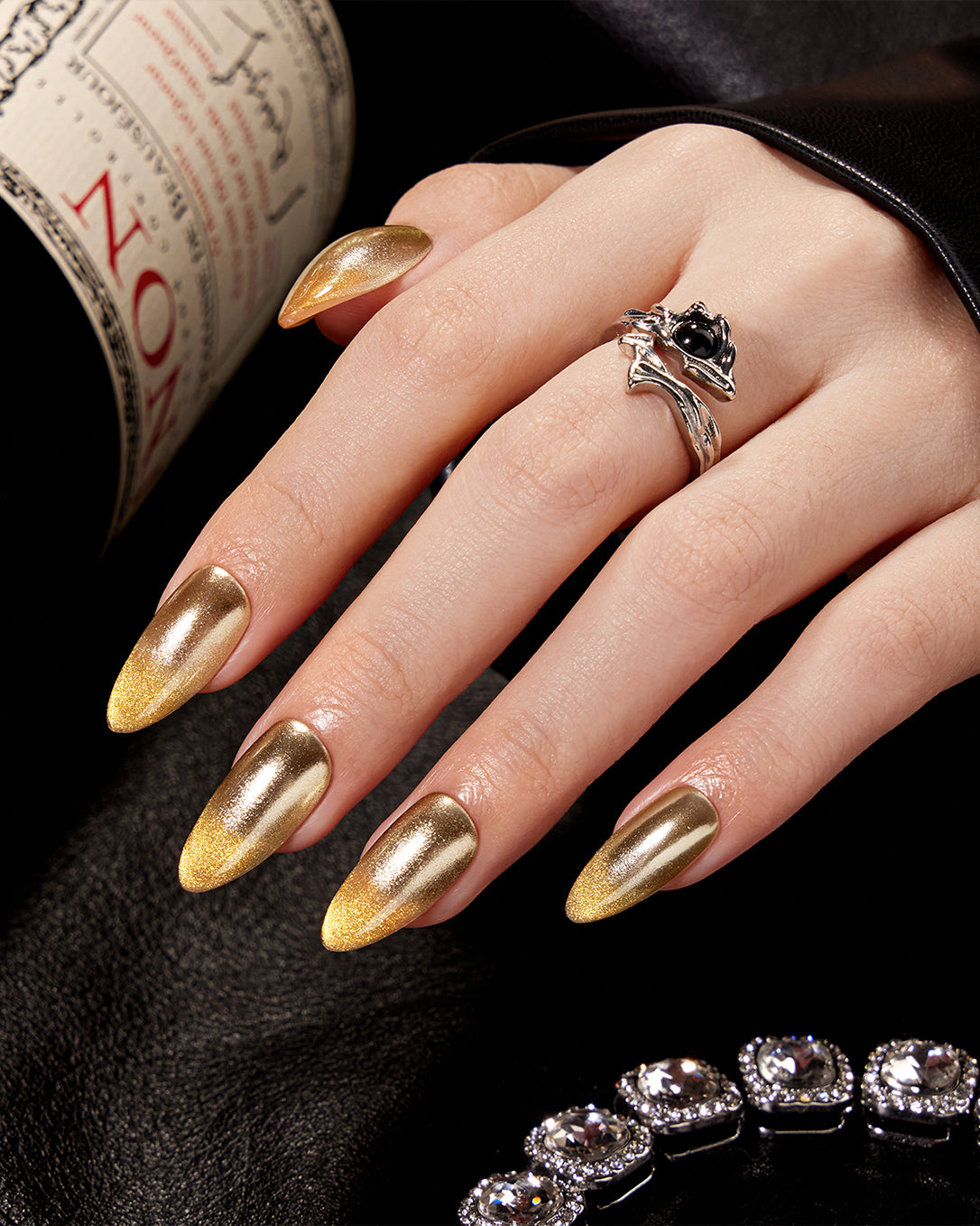 Model wearing VSALON Luminous Horizon press-on nails with a radiant golden manicure and elegant holiday-inspired design.