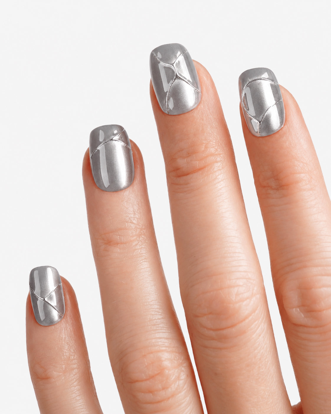 Close-up of VSALON Metropolis Beam press-on nails showcasing the shimmering 3D metallic effect and grey-silver cat eye design.