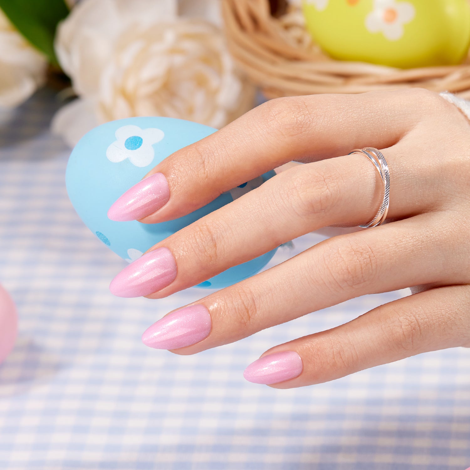 pastel pink easter nails on hand, perfect for spring outfits