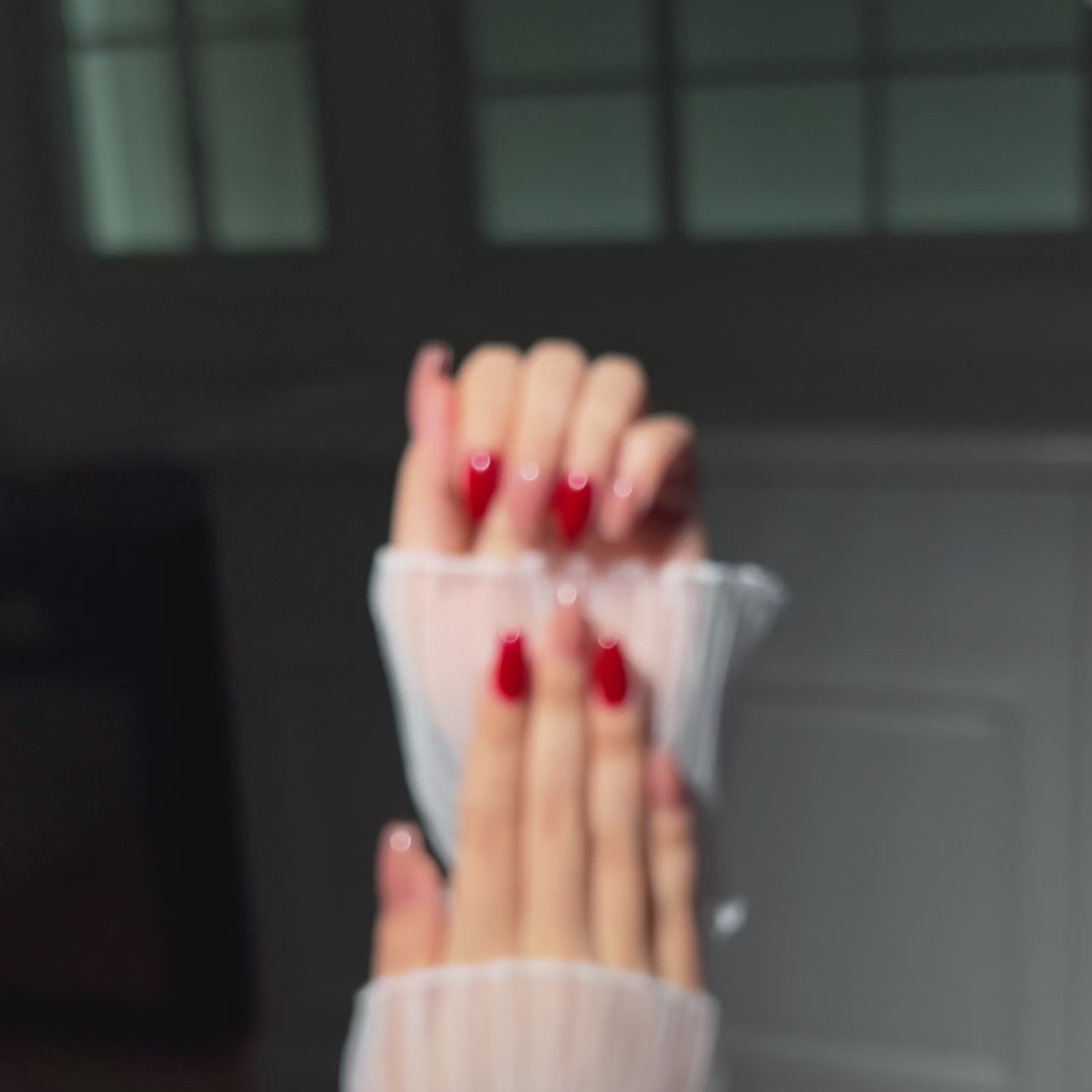 Load video: VSALON Dual Glam Nails Happy Glow Red Solid Color Short Coffin Press On Nails - Model&#39;s hands with fingers crossed showing VSALON press on nails – highlighting nail design and style