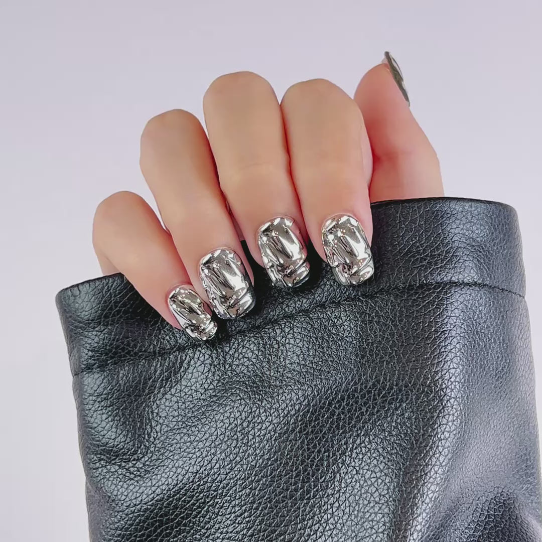Load video: VSALON Nourishment Edge Mirage Rock 3D Textured Short Square Press On Nails - Close-up of VSALON punk press on nails with metallic studs and bold design