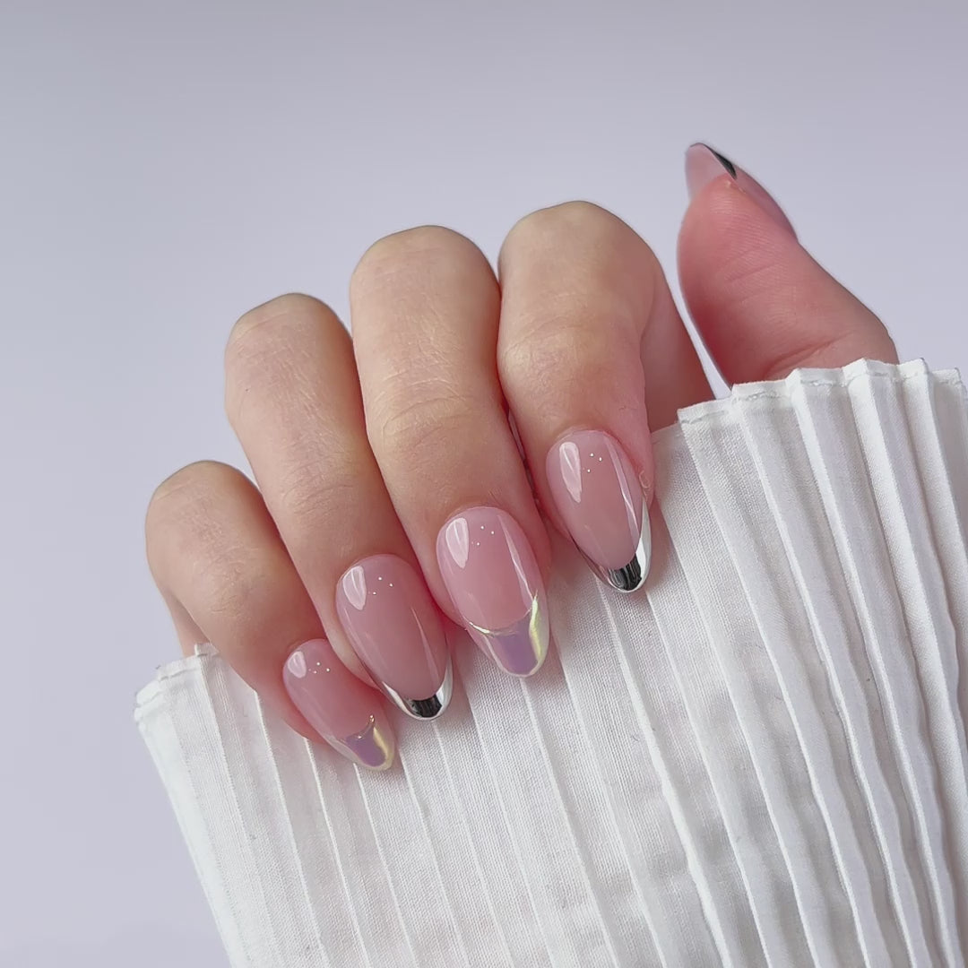 Load video: VSALON Dual Glam Nails Discours French Tips Short Almond Press On Nails - Close-up of model&#39;s hand bending fingers to hold VSALON press on nails – highlighting nail design and color details