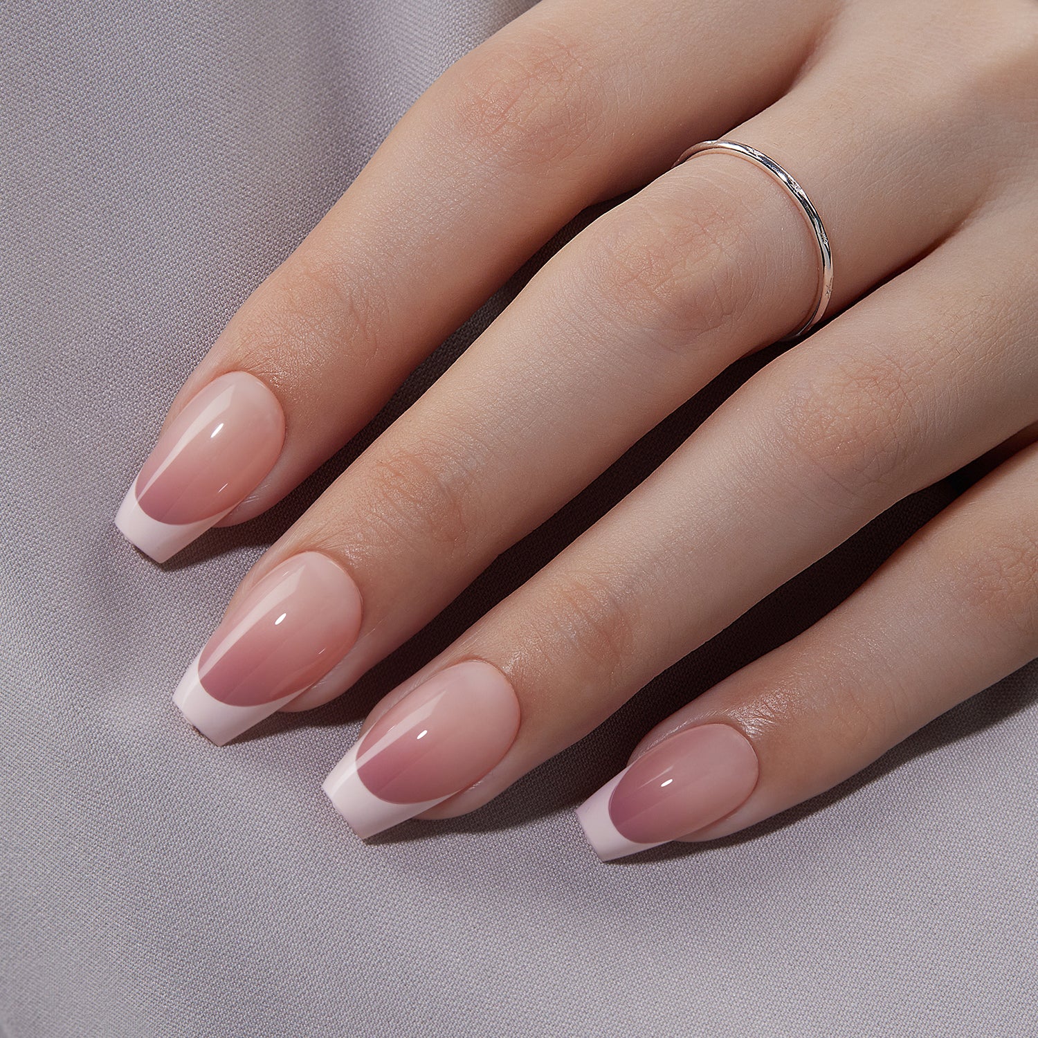 VSALON Dual Glam Nails Belle De Jour French Tips Short Coffin Press On Nails - model's hand resting on elbow – showcasing nail style and elegant manicure