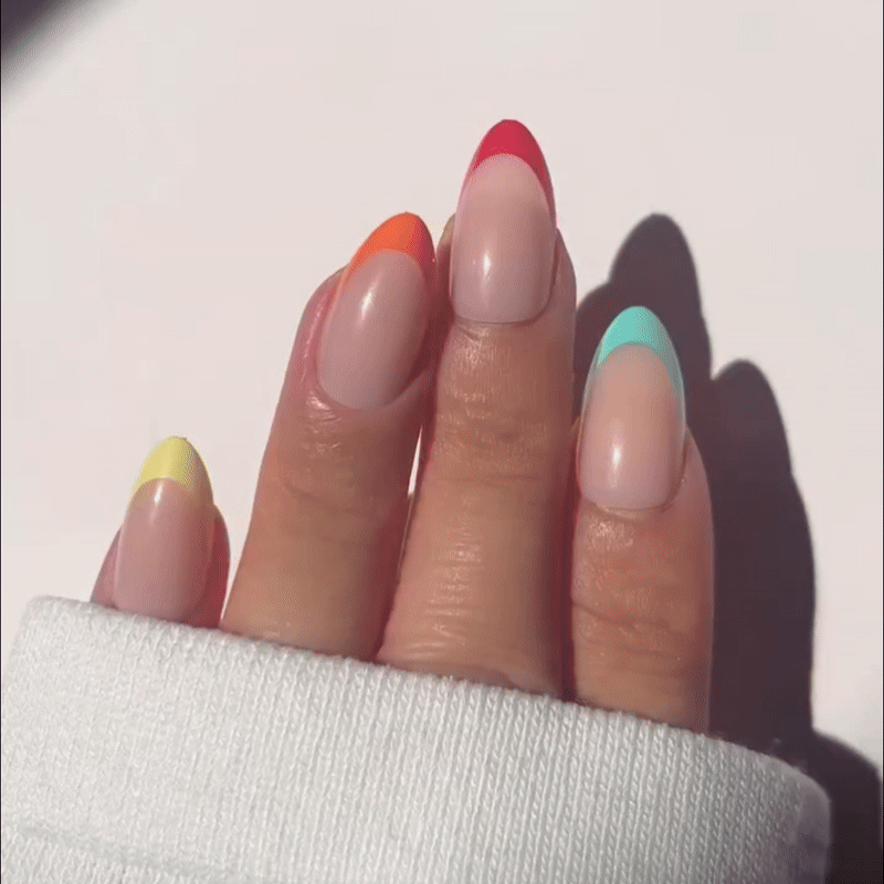 VSALON Nourishment Color Pop French Tips Short Almond Press On Nails - model's hand holding the top of the box – displaying nail design and product packaging