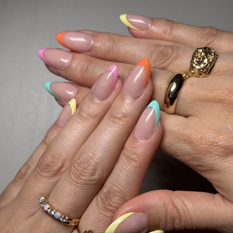 VSALON Nourishment Color Pop French Tips Short Almond Press On Nails - Model showing nails with both hands – displaying nail design and manicure style