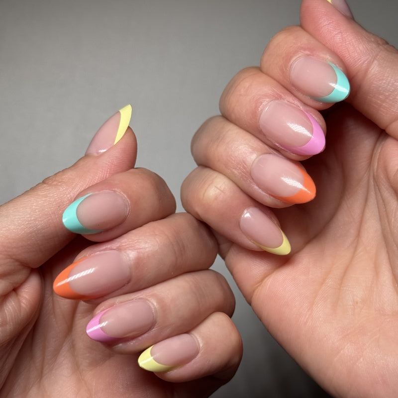 VSALON Nourishment Color Pop French Tips Short Almond Press On Nails - Model showing nails with both hands – displaying nail design and manicure style