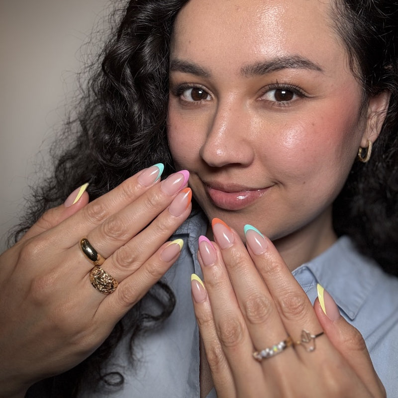 VSALON Nourishment Color Pop French Tips Short Almond Press On Nails - Model showing nails with both hands – displaying nail design and manicure style