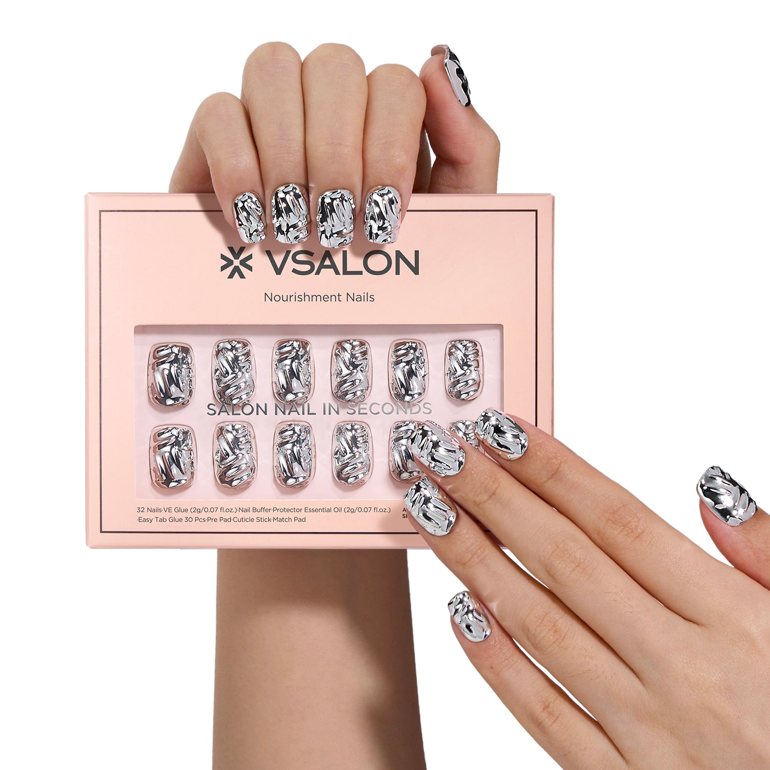 Model holding VSALON press on nails box diagonally with both hands – highlighting packaging and nail set presentation