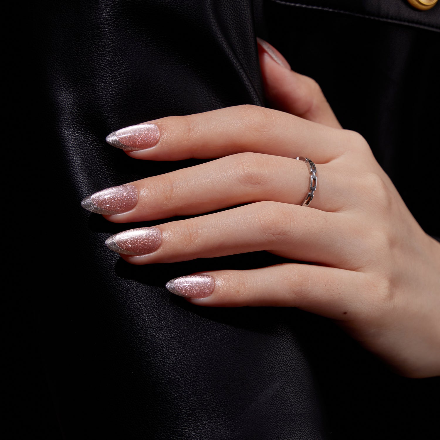 VSALON Nourishment First Dance Pink Metallic French Tips  Short Almond Press On Nails - model's hand resting on elbow – showcasing nail style and elegant manicure