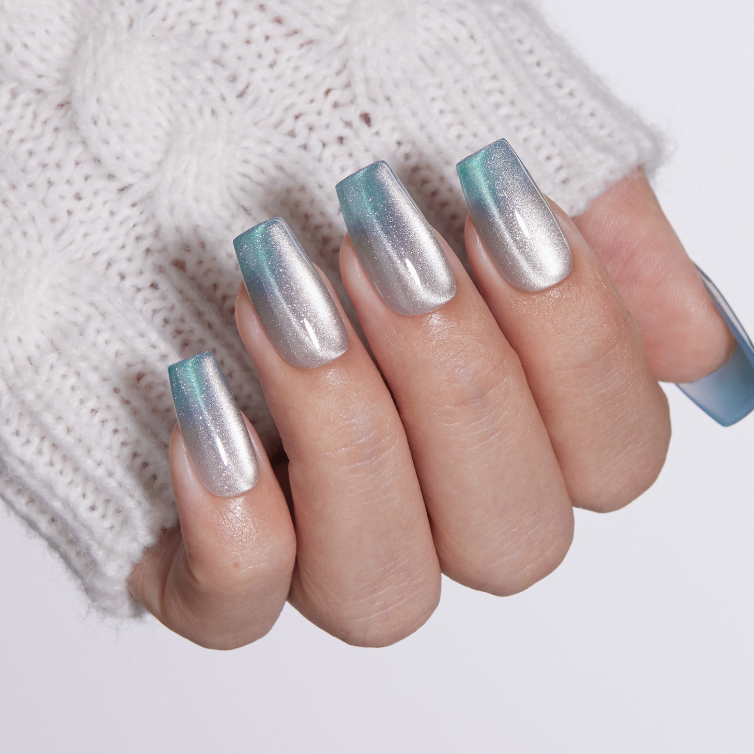 VSALON Nourishment Frozen Muse Silver Ombre Cat Eye Chrome Short Coffin Press On Nails - Close-up of model's hand bending fingers to hold VSALON press on nails – highlighting nail design and color details