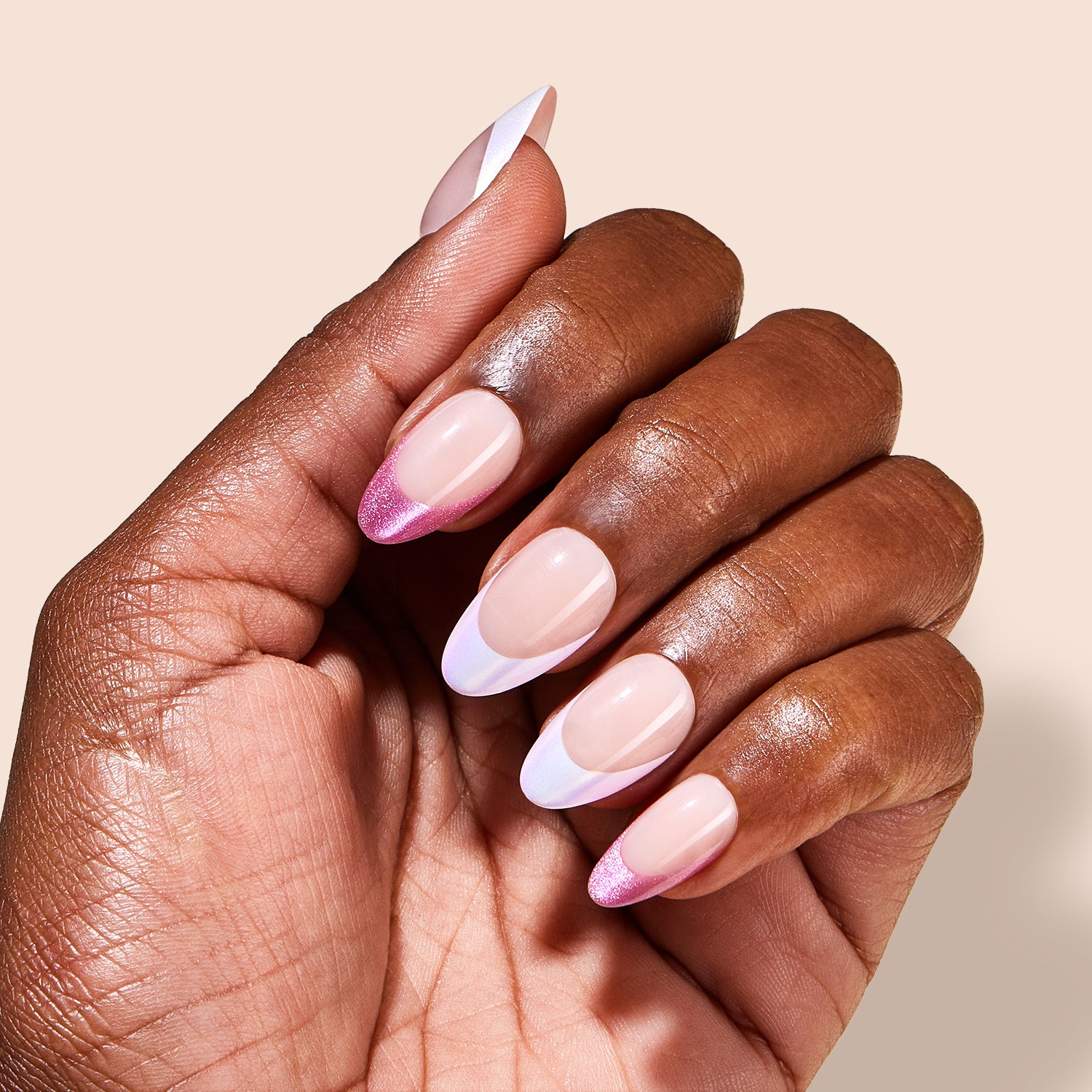 VSALON Dual Glam Nails Liberty Tips Pink French Tips Short Almond Press On Nails - Model holding VSALON press on nails box diagonally with both hands – highlighting packaging and nail set presentation