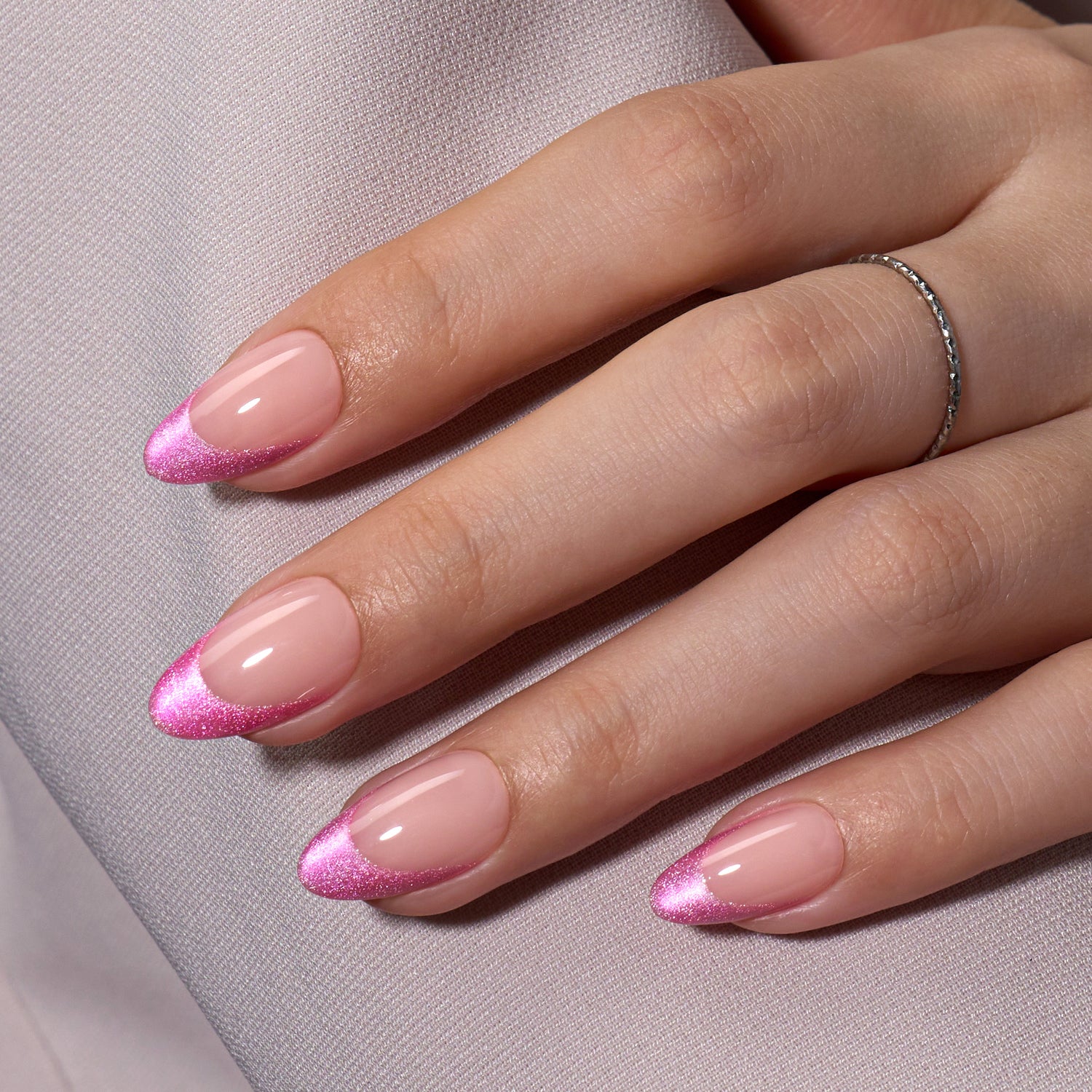 VSALON Dual Glam Nails Liberty Tips Pink French Tips Short Almond Press On Nails - model's hand resting on elbow – showcasing nail style and elegant manicure