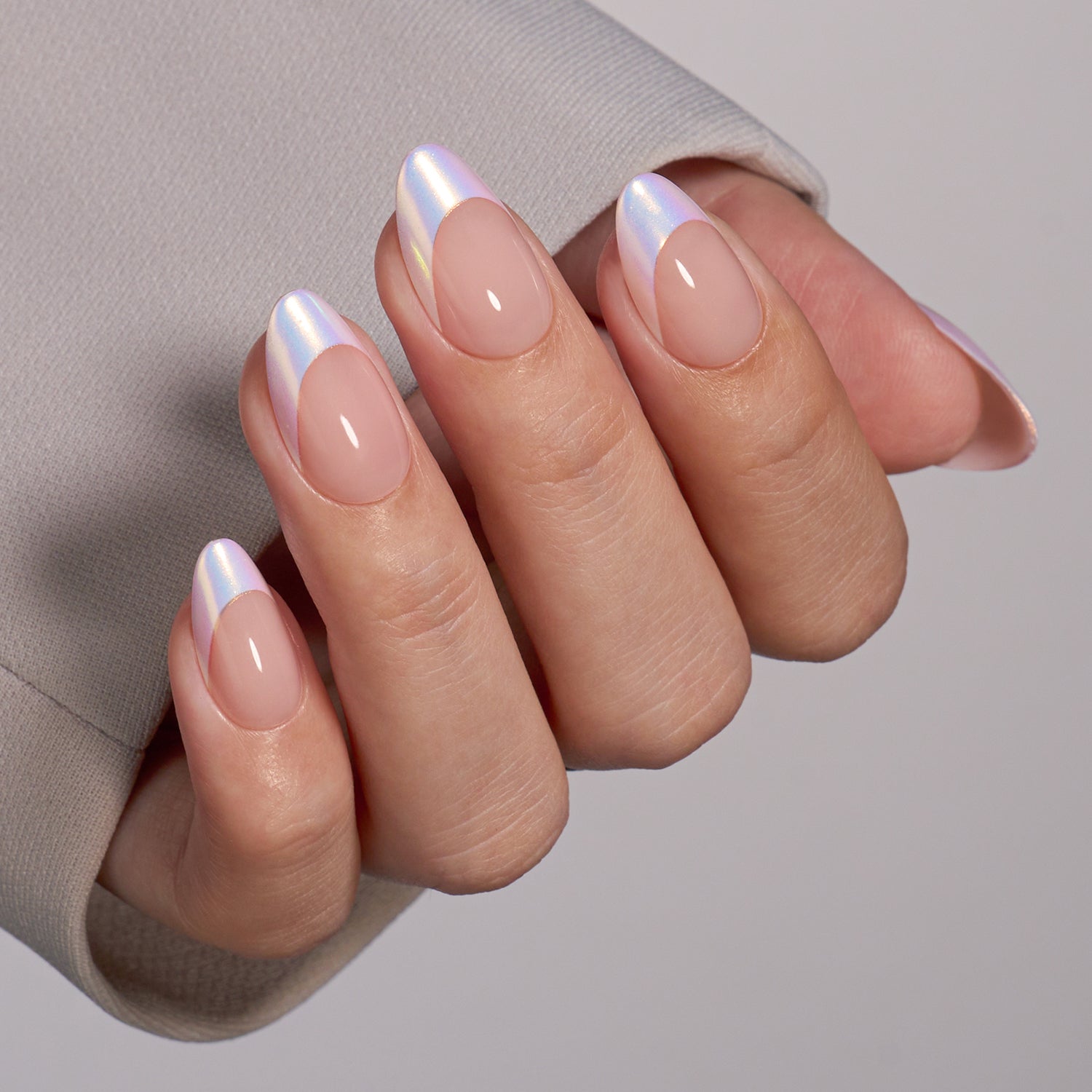 VSALON Dual Glam Nails Liberty Tips Pink French Tips Short Almond Press On Nails - Close-up of model's hand bending fingers to hold VSALON press on nails – highlighting nail design and color details