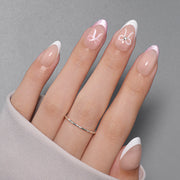 VSALON Dual Glam Nails Lovers Note Bow French Tips Short Almond Press On Nails - model wearing