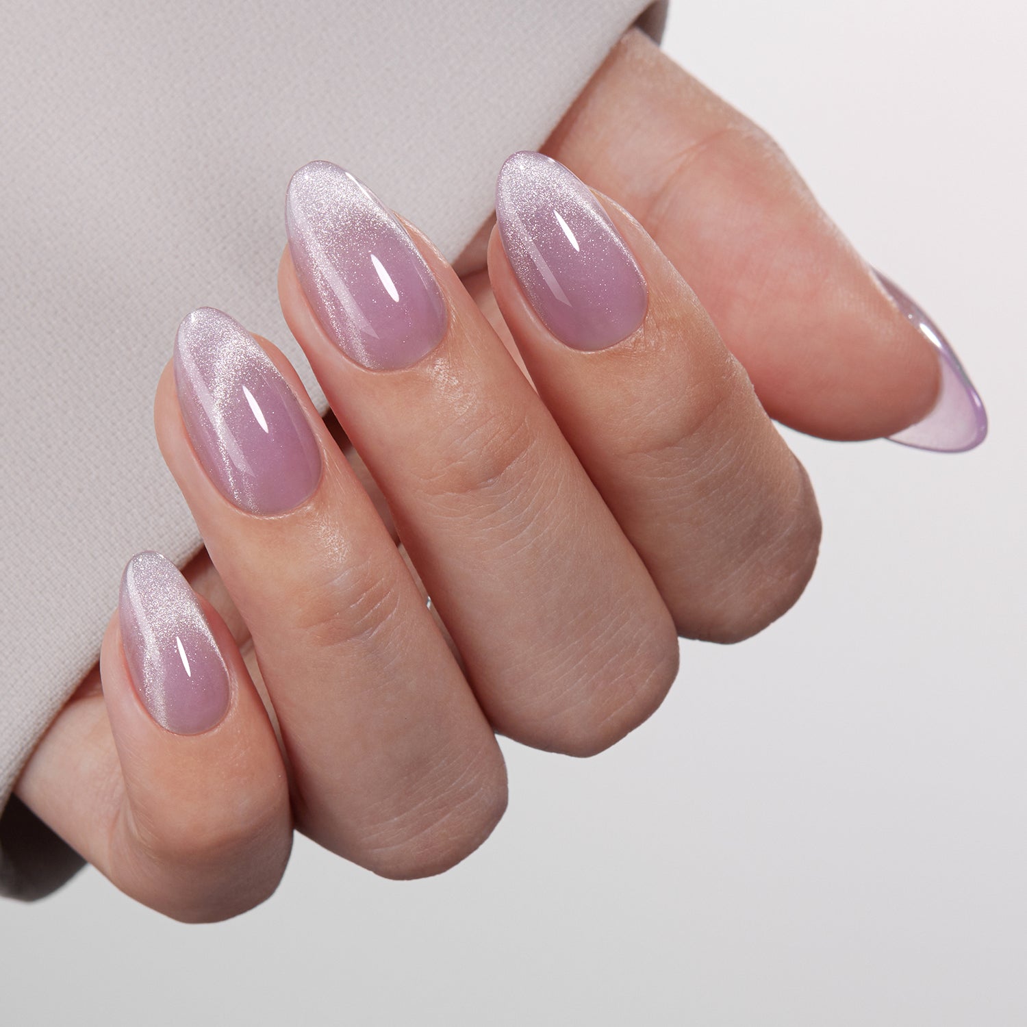 VSALON UV Cure Nails Mist Lilac Lavender Cat Eye Short Almond Press On Nails - Close-up of model's hand bending fingers to hold VSALON press on nails – highlighting nail design and color details