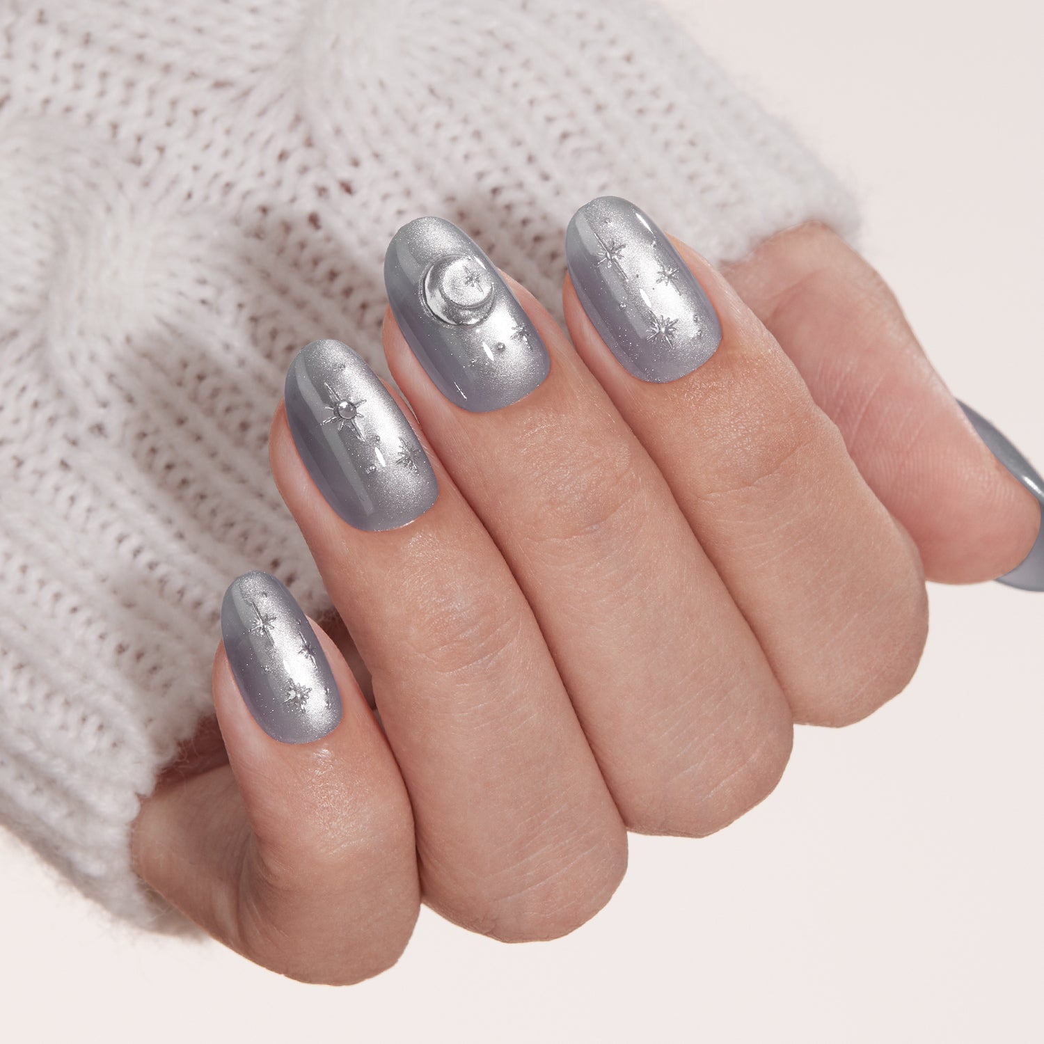 VSALON Nourishment Moonlight Sonata 3D Frosty Star Cat Eye Short Oval Press On Nails - Close-up of model's hand bending fingers to hold VSALON press on nails – highlighting nail design and color details
