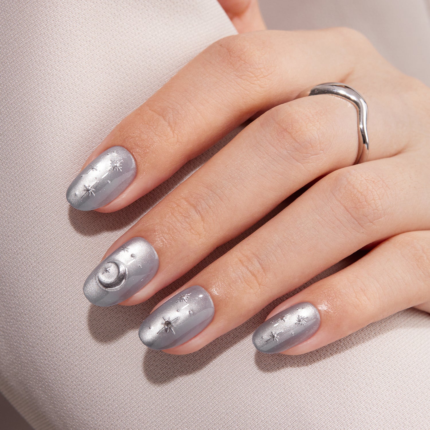 VSALON Nourishment Moonlight Sonata 3D Frosty Star Cat Eye Short Oval Press On Nails - model's hand resting on elbow – showcasing nail style and elegant manicure