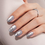 VSALON Nourishment Moonlight Sonata 3D Frosty Star Cat Eye Short Oval Press On Nails - model's hand resting on elbow – showcasing nail style and elegant manicure