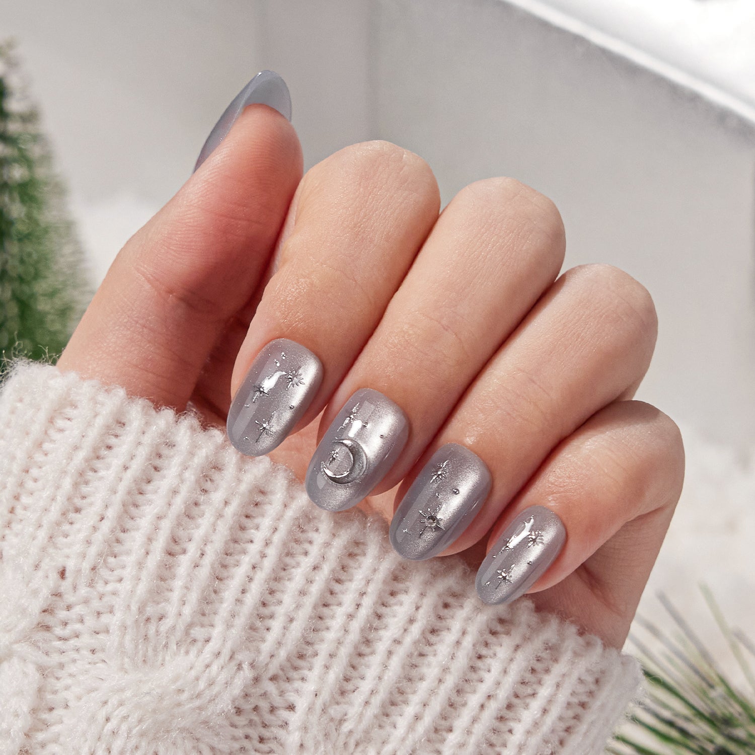 VSALON Nourishment Moonlight Sonata 3D Frosty Star Cat Eye Short Oval Press On Nails - Close-up of model's hand bending fingers to hold VSALON press on nails – highlighting nail design and color details