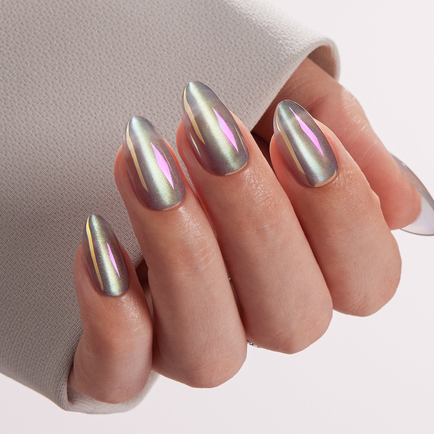 VSALON Nourishment Moonstone Cat Eye Glossy Short Almond Press On Nails - Close-up of model's hand bending fingers to hold VSALON press on nails – highlighting nail design and color details