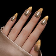 VSALON Nourishment Ra Gold Gold Metallic Cat-Eye Medium Almond Press On Nails - model wearing