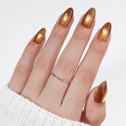 VSALON Nourishment Nails “Truffle Halo” Gold Short Almond Press On Nails – model wearing.