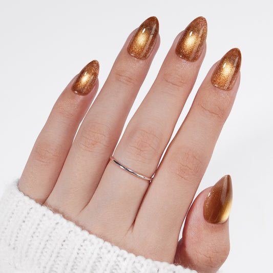 VSALON Nourishment Nails “Truffle Halo” Gold Short Almond Press On Nails – model wearing.