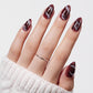 VSALON Nourishment Nails “Mocha Marble” Marble Short Almond Press On Nails – model wearing.