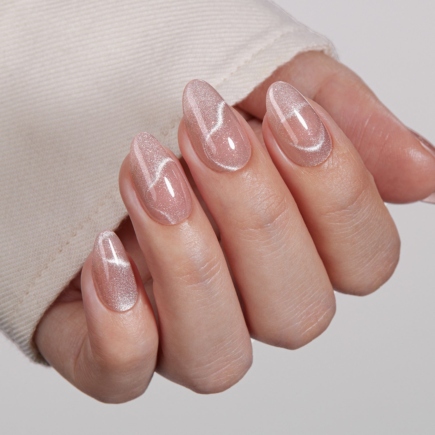 VSALON Dual Glam Nails Romantic Floral Pink Heart Short Almond Press On Nails - Close-up of model's hand bending fingers to hold VSALON press on nails – highlighting nail design and color details