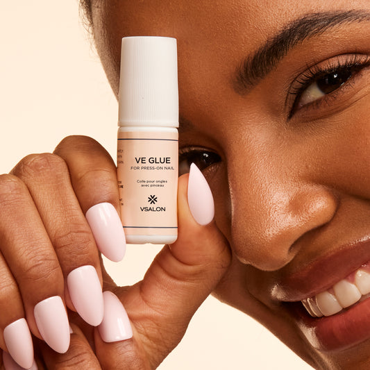 Close-up of VSALON Vitamin E nail glue – protects natural nails while applying press on sets