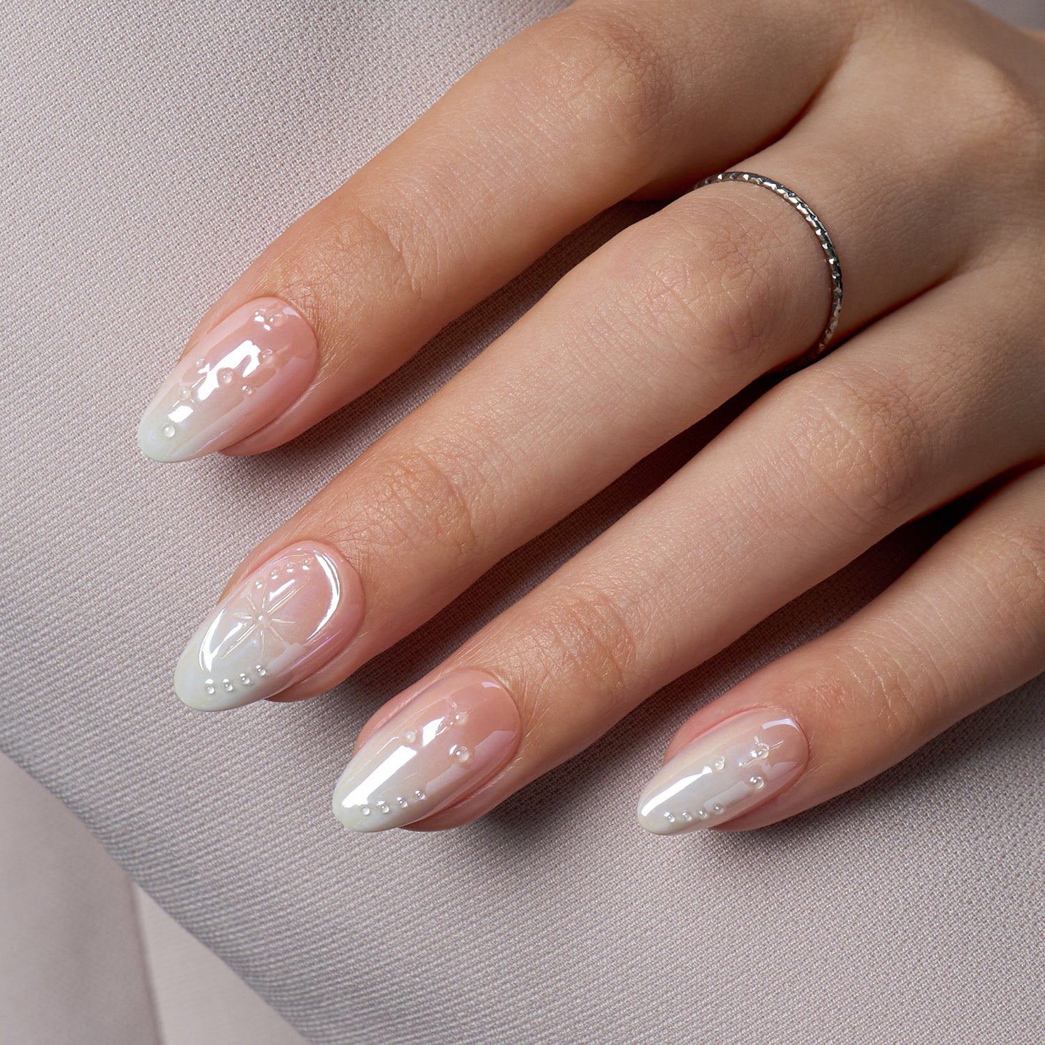 VSALON Dual Glam Nails Weekend Warrior Star 3D Textured Short Almond Press On Nails - model's hand resting on elbow – showcasing nail style and elegant manicure