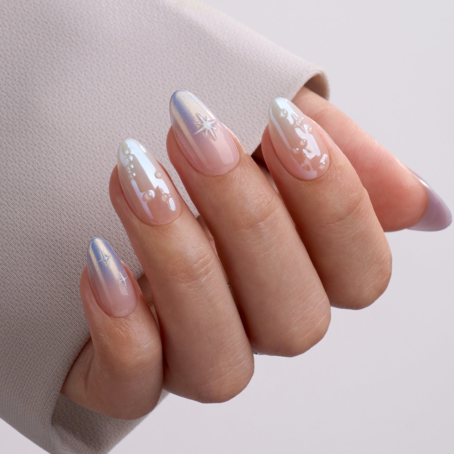 VSALON Dual Glam Nails Weekend Warrior Star 3D Textured Short Almond Press On Nails - Close-up of model's hand bending fingers to hold VSALON press on nails – highlighting nail design and color details